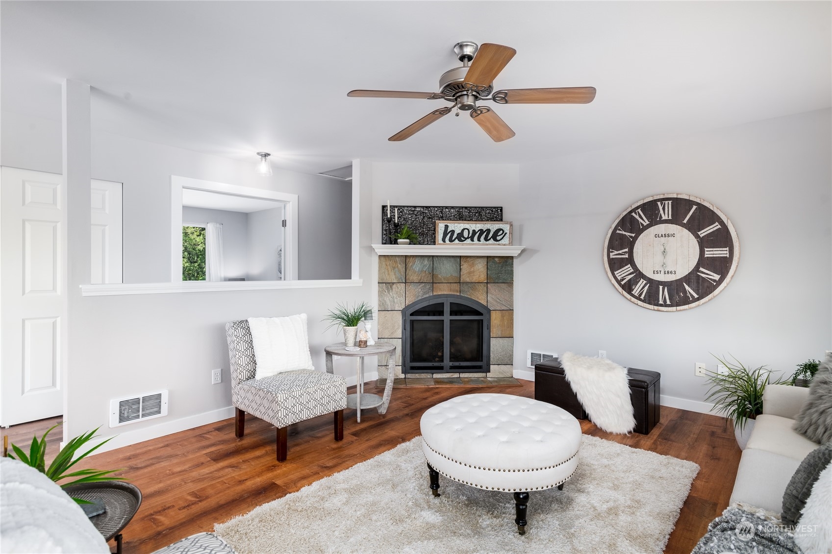 5701 Lerch Road Snohomish, WA 98290 - Photo 7 of 34 a living room with furniture a rug and a fireplace