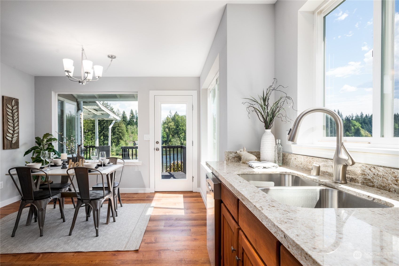 5701 Lerch Road Snohomish, WA 98290 - Photo 10 of 34 a kitchen with a table chairs sink and natural light