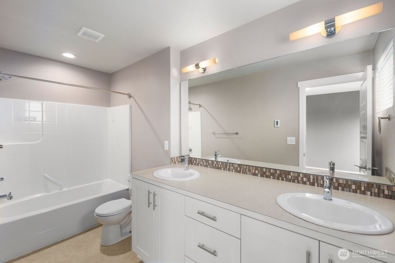 1325 Seattle Hill Road, Unit A2 Bothell, WA 98012 - Photo 24 of 34 a bathroom with a granite countertop sink toilet and shower