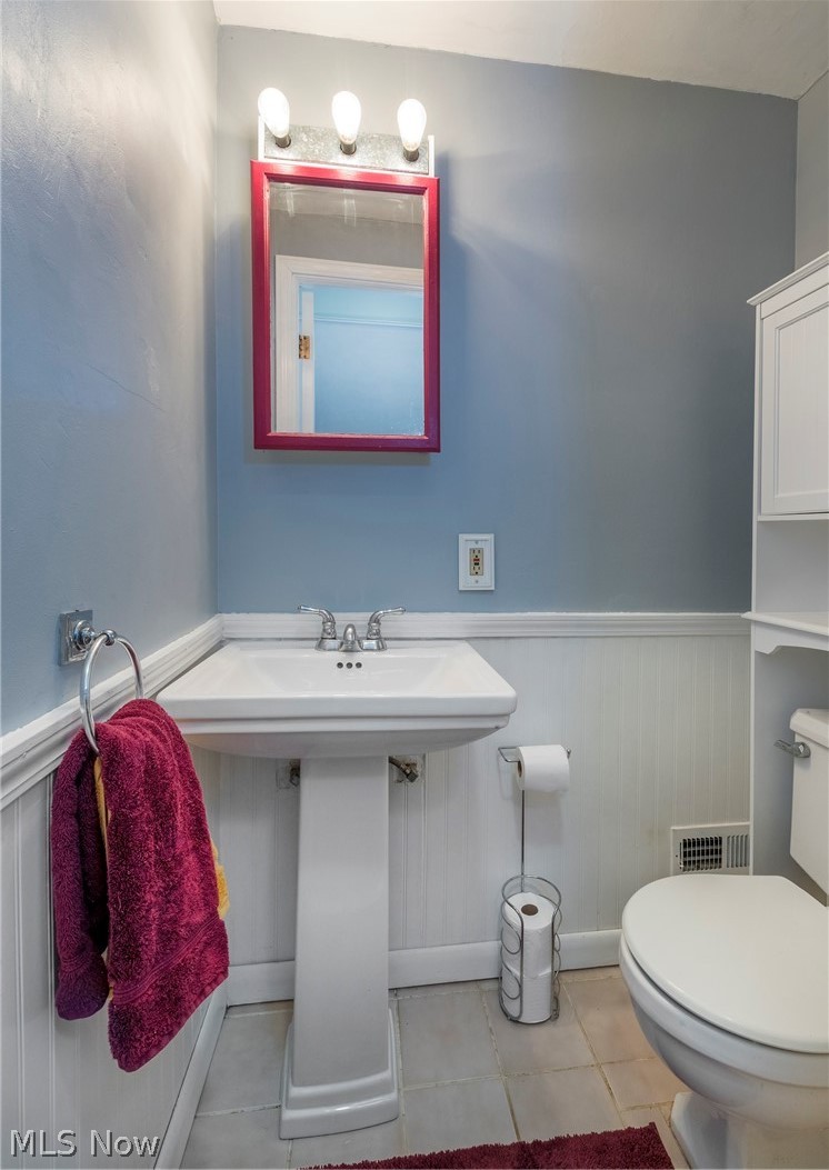 1170 Roland Road Lyndhurst, OH 44124 - Photo 12 of 36 Bathroom with toilet and tile floors
