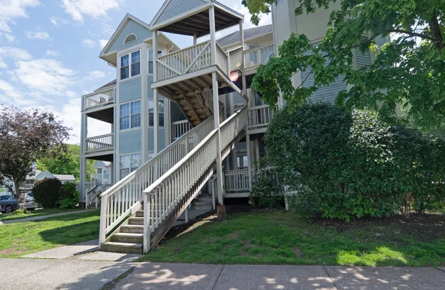 a view of a house with a small yard
