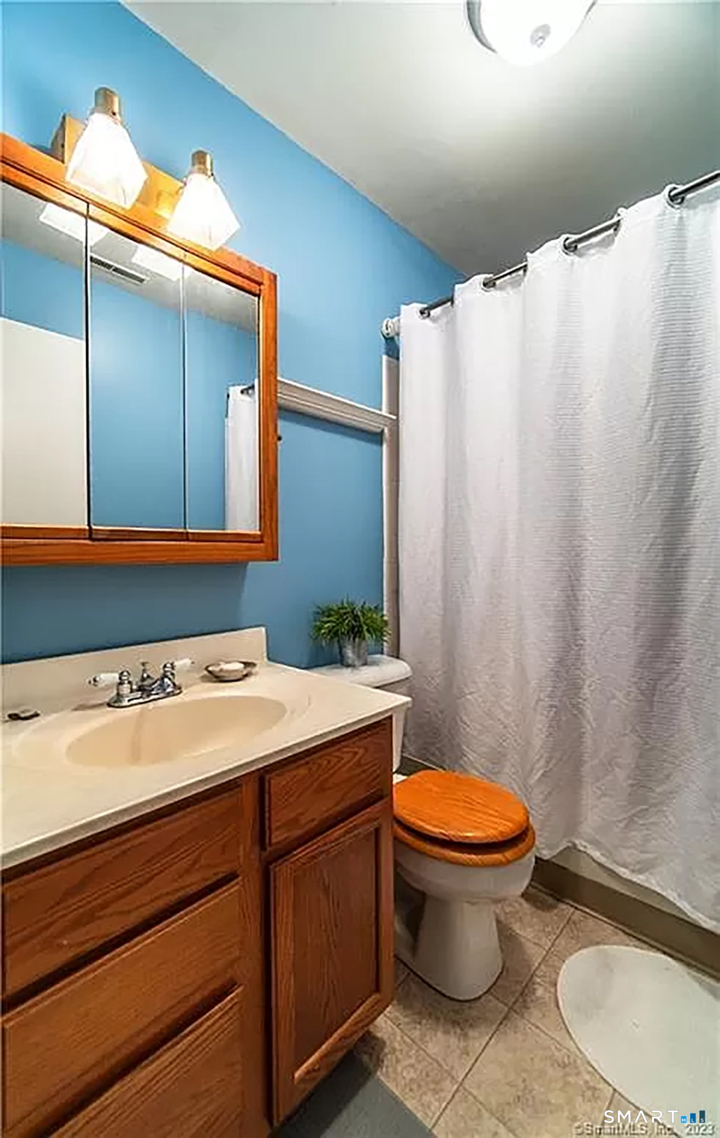 5 Stonegate Circle, Unit F Branford, CT 06405 - Photo 13 of 15 a bathroom with a sink a toilet and shower