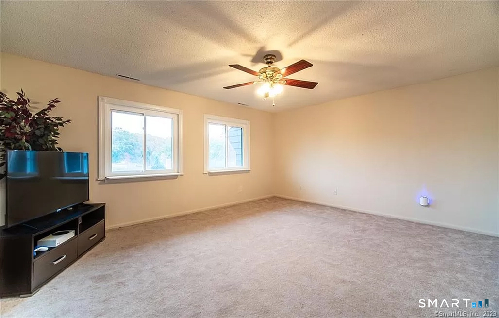 5 Stonegate Circle, Unit F Branford, CT 06405 - Photo 4 of 15 a view of empty room with window