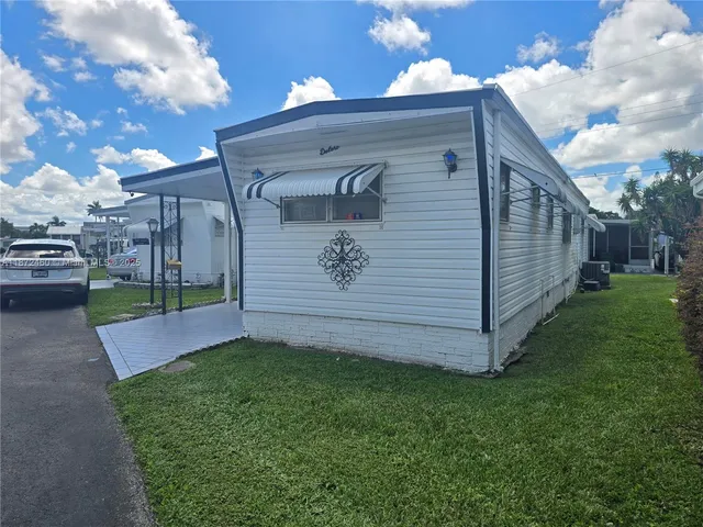a view of backyard with potted plants