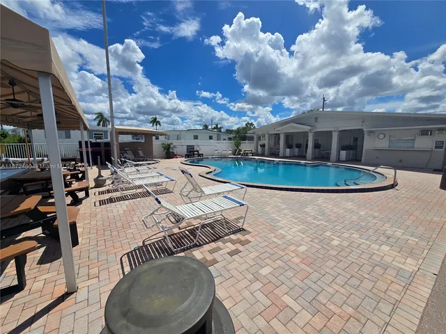 a view of a house with swimming pool
