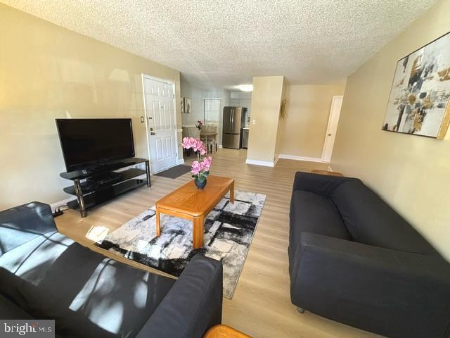 27 Gilpin Court Lawrence Township, NJ 08648 - Photo 3 of 20 a living room with furniture and a flat screen tv