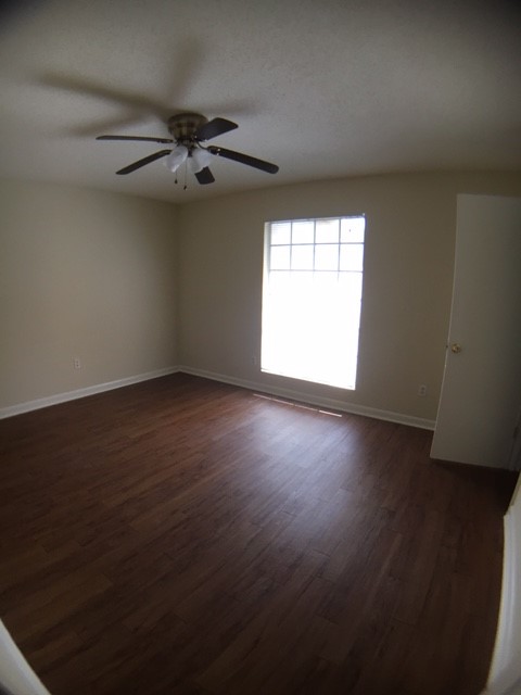 4709 Harmon Avenue, Unit 416 Austin, TX 78751 - Photo 6 of 8 a view of an empty room with wooden floor and a window