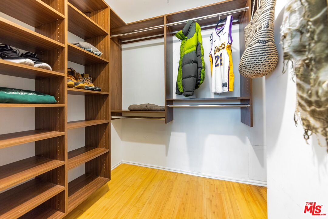 1255 10th Street, Unit 106 Santa Monica, CA 90401 - Photo 11 of 15 a view of walk in closet with clothes and shoes
