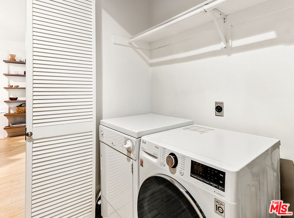 1255 10th Street, Unit 106 Santa Monica, CA 90401 - Photo 9 of 15 a utility room with dryer and washer