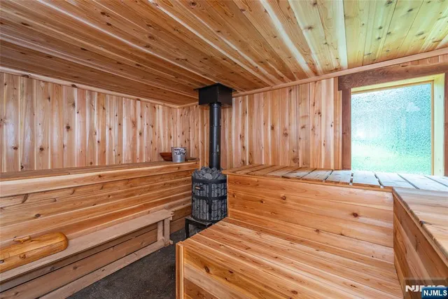 a view of a wooden deck with chairs and a yard