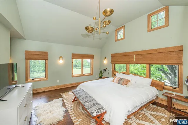 a backyard of a house with a yard and outdoor seating