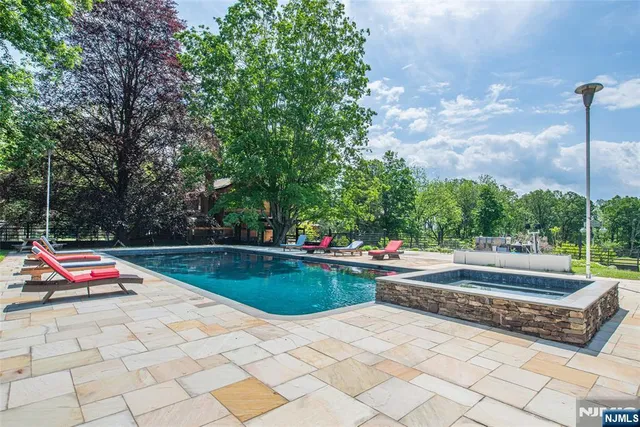 a kitchen with stainless steel appliances granite countertop a stove and a sink