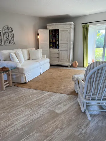 a bedroom with a bed and a night stand