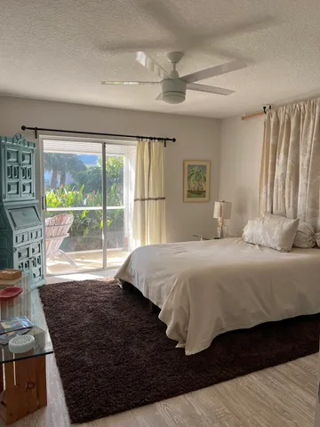 a bedroom with a bed window and a bed