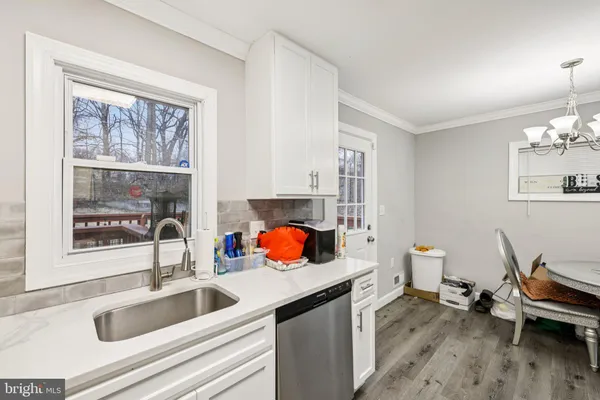 a kitchen with a sink and a window