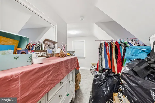 a bed room with a bed and a walk in closet