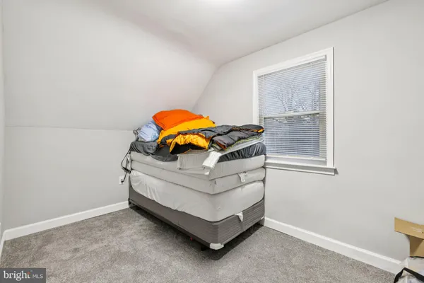 a white stove sitting in a room next to a window