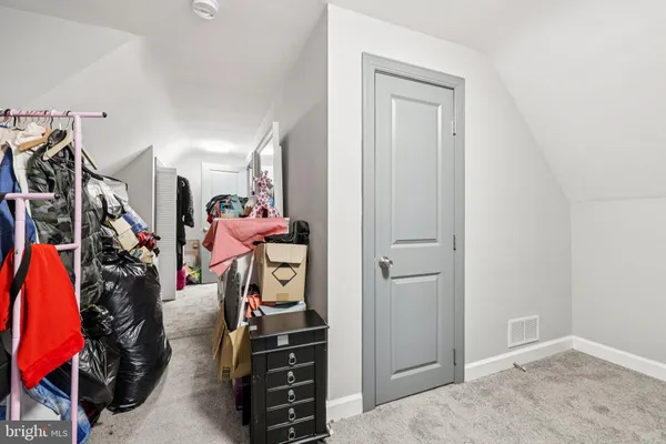 a view of a livingroom with furniture and closet