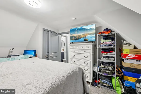 a bed room with a bed and a baby bed