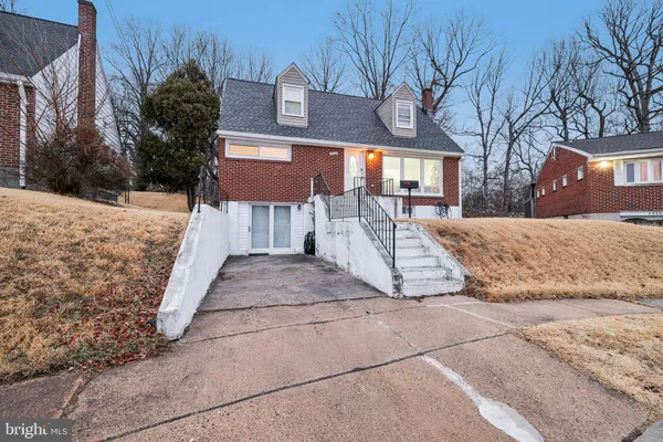 a view of a house with a yard and snow