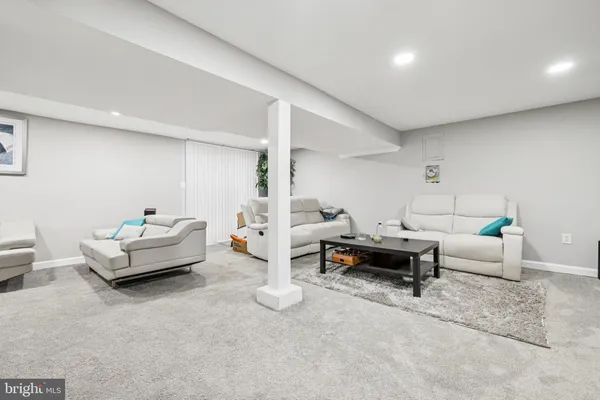a living room with furniture and a table