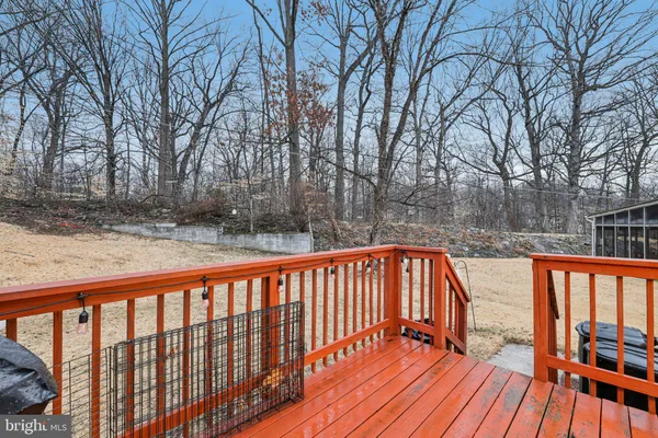 a balcony with trees in front of it