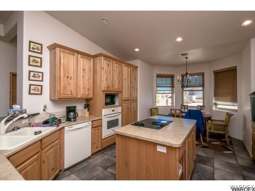 4951 North Neal Ranch Road Kingman, AZ 86401 - Photo 28 of 34 a kitchen that has a sink cabinets counter space and a window