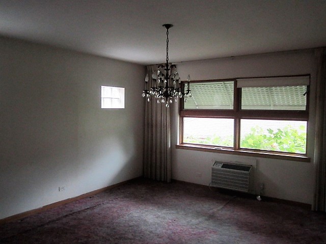 2926 Harlem Avenue Riverside, IL 60546 - Photo 13 of 20 an empty room with windows and chandelier