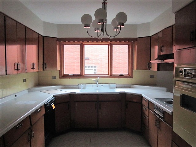 2926 Harlem Avenue Riverside, IL 60546 - Photo 4 of 20 a kitchen with a sink cabinets window and stainless steel appliances