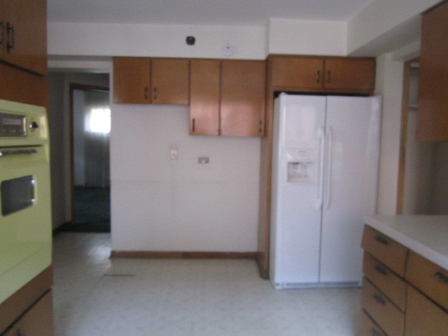 2926 Harlem Avenue Riverside, IL 60546 - Photo 5 of 20 a view of hallway with cabinets and wooden floor