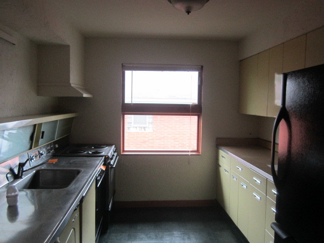 2926 Harlem Avenue Riverside, IL 60546 - Photo 7 of 20 a kitchen with a sink stove and cabinets
