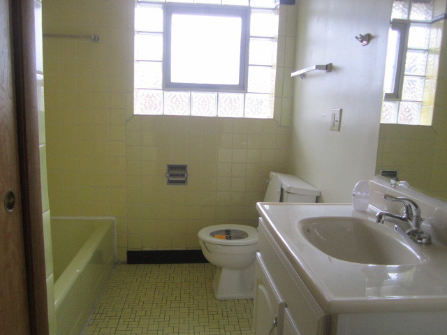 2926 Harlem Avenue Riverside, IL 60546 - Photo 8 of 20 a bathroom with a sink a toilet and a mirror