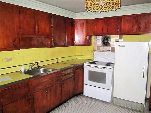 2926 Harlem Avenue Riverside, IL 60546 - Photo 9 of 20 a kitchen with a sink and a stove top oven
