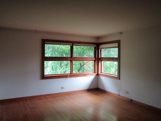 2926 Harlem Avenue Riverside, IL 60546 - Photo 10 of 20 an empty room with wooden floor and windows