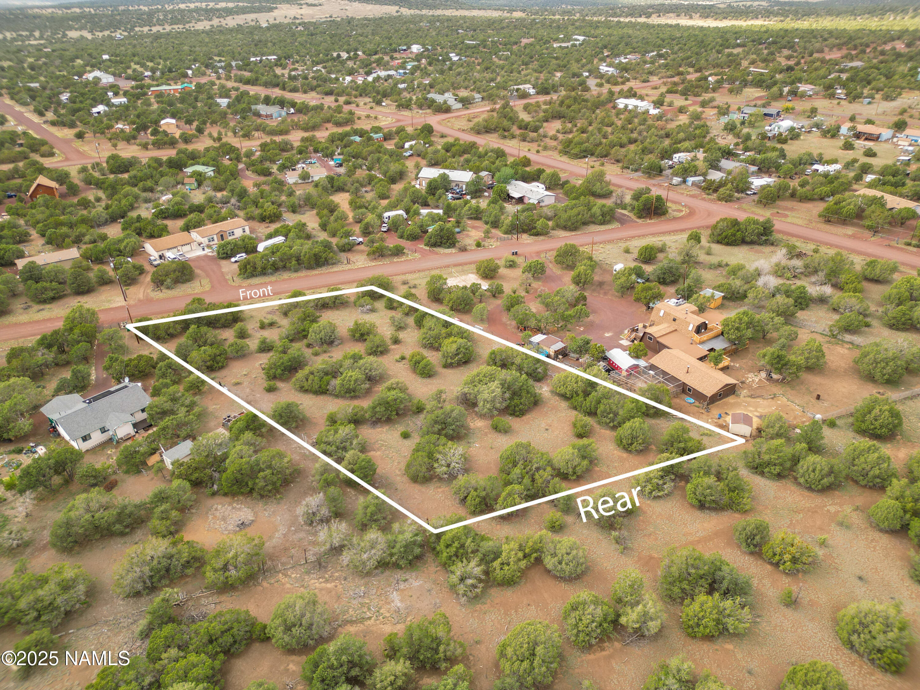 7365 North Hopi Street Williams, AZ 86046 - Photo 8 of 12 an aerial view of residential houses with outdoor space