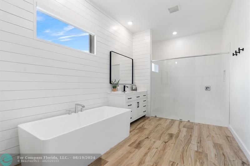 793 Hookline Circle Loxahatchee, FL 33470 - Photo 12 of 80 a bathroom with a bathtub and a sink