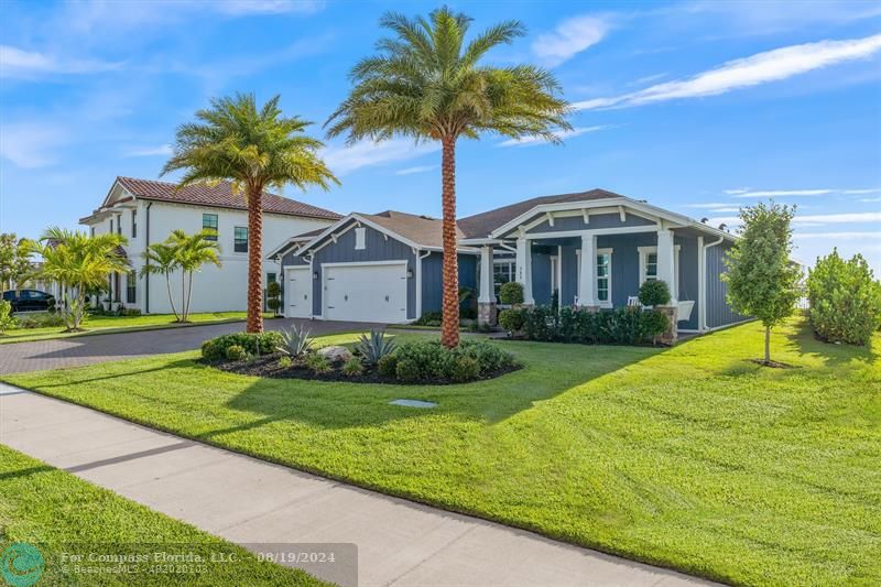 793 Hookline Circle Loxahatchee, FL 33470 - Photo 32 of 80 a front view of house with yard and green space