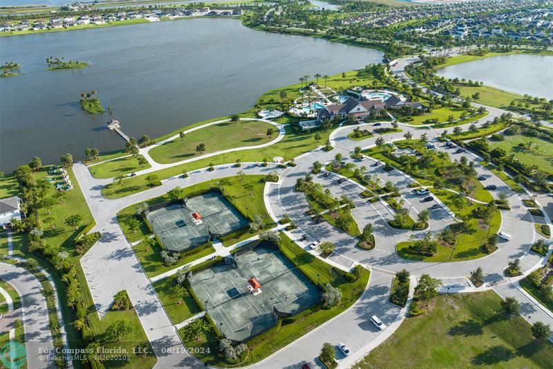 793 Hookline Circle Loxahatchee, FL 33470 - Photo 60 of 80 an aerial view of a house with a lake view