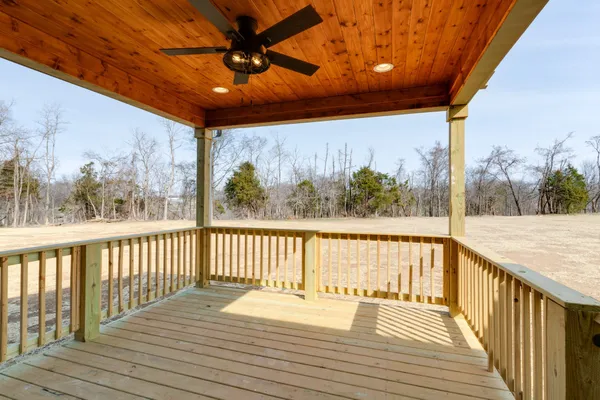 a view of a balcony with wooden floor