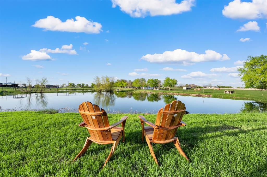 7384 Rector Road Sanger, TX 76266 - Photo 5 of 40 a view of a lake with a lounge chair