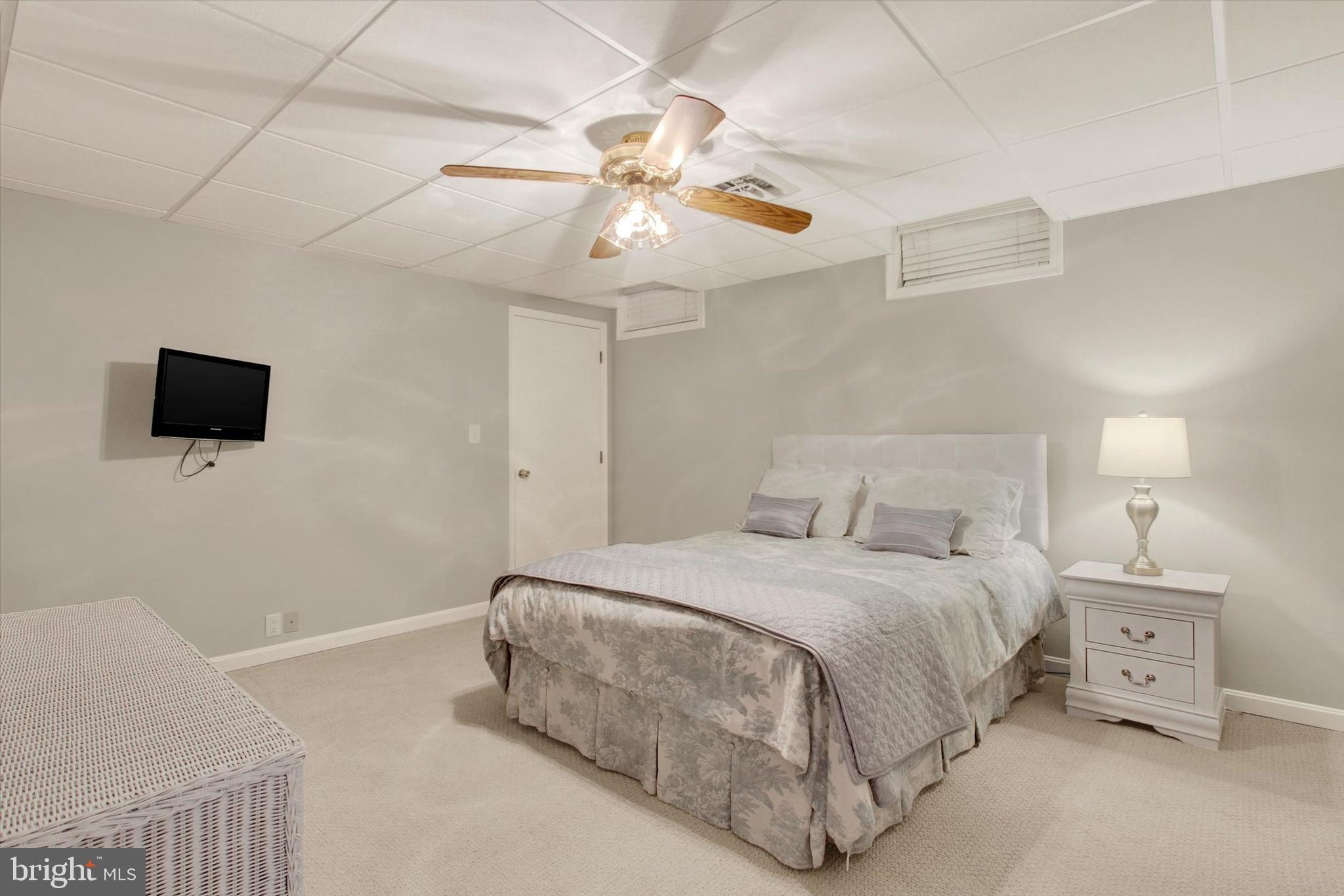 1669 Beck Mill Road Hanover, PA 17331 - Photo 54 of 81 a bedroom with a bed and a flat screen tv