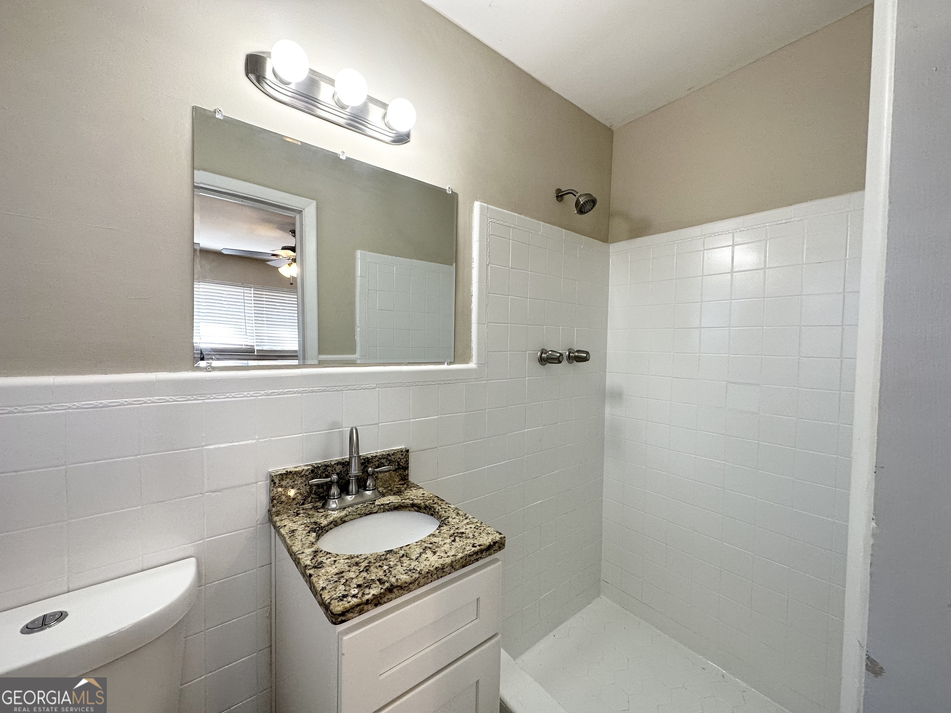 2896 Hogan Road East Point, GA 30344 - Photo 12 of 14 a bathroom with a sink toilet and shower