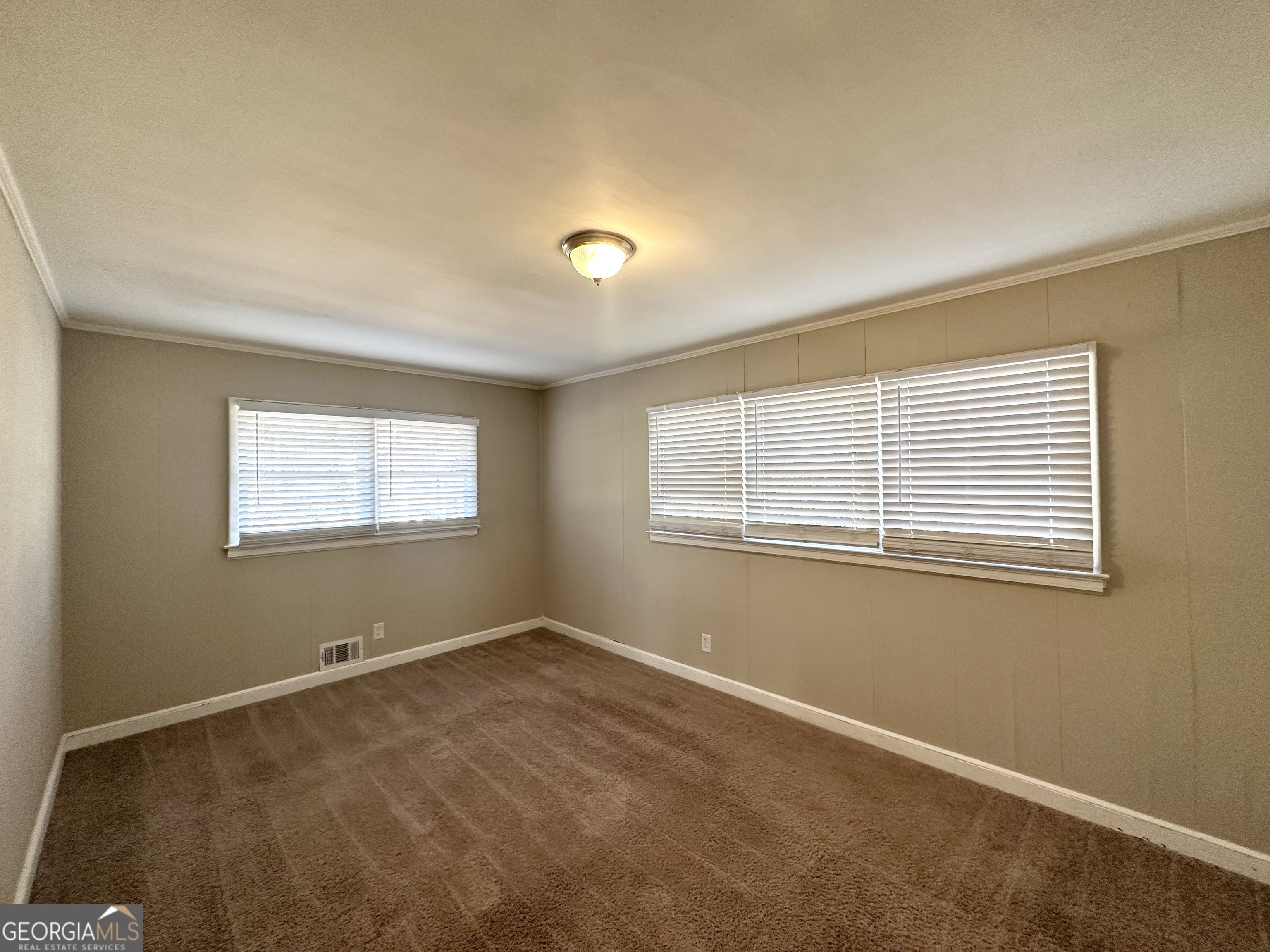 2896 Hogan Road East Point, GA 30344 - Photo 5 of 14 a view of an empty room with a window
