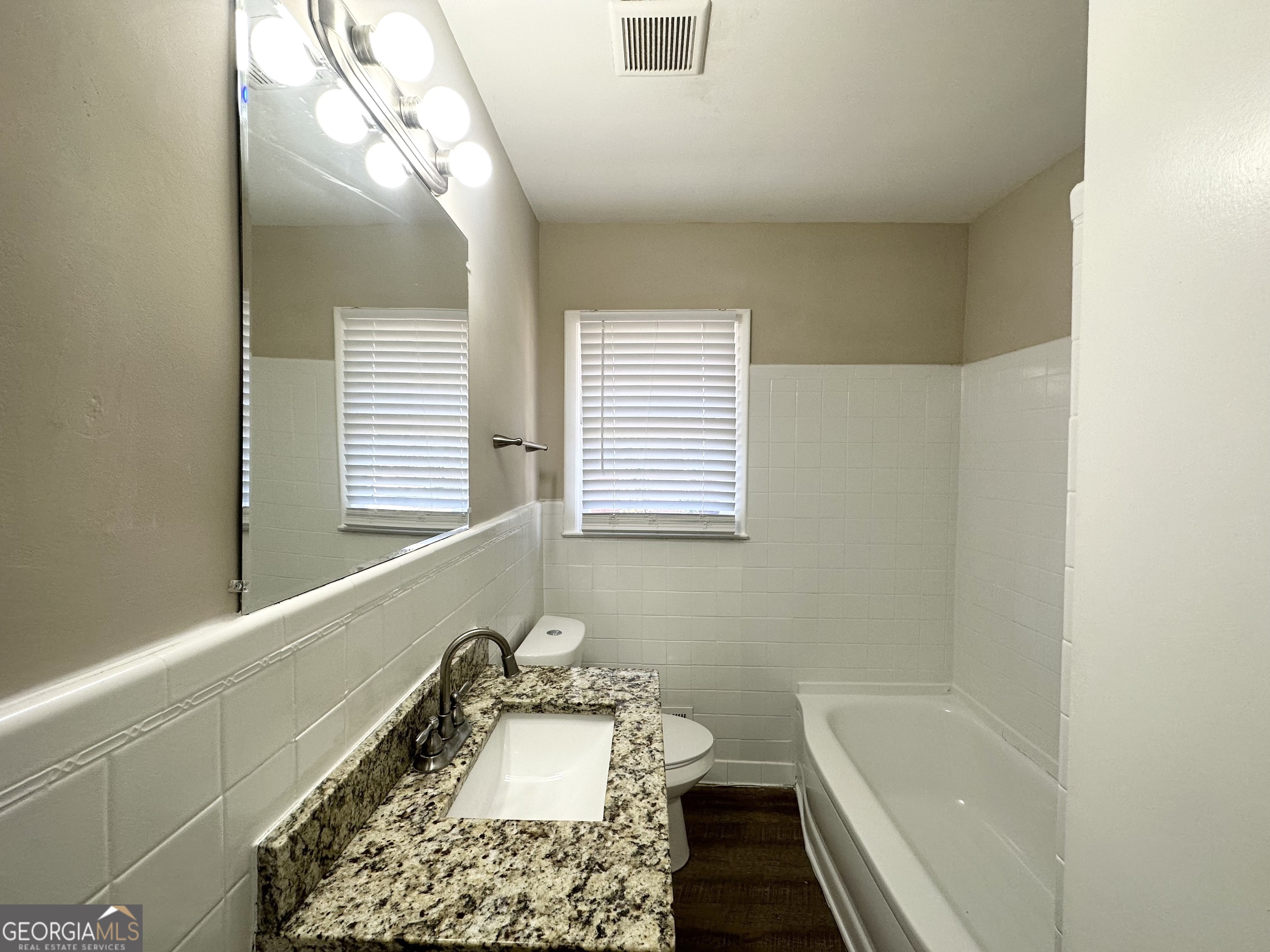 2896 Hogan Road East Point, GA 30344 - Photo 10 of 14 a bathroom with a sink a toilet and tub