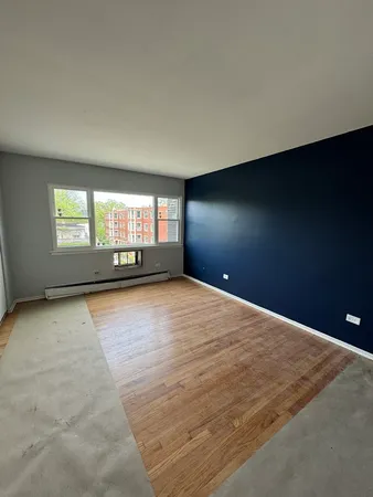 an empty room with a empty space and windows