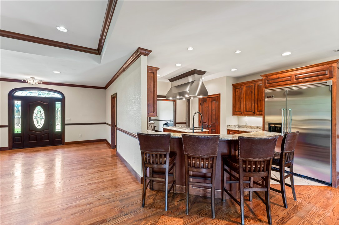 579 Terrapin Crossing Road Pickens, SC 29671 - Photo 11 of 50 A chef's dream, this kitchen features a 48 in gas cooktop island with a professional hood, 48 in built-in refrigerator, warming drawer, double ovens and built in microwave as well as a trash compactor