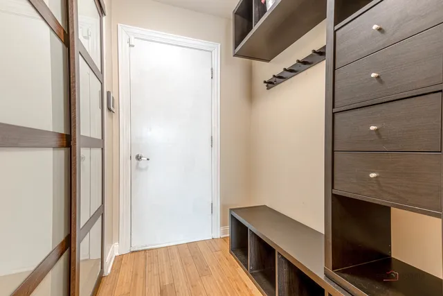 a view of hallway with wooden floor
