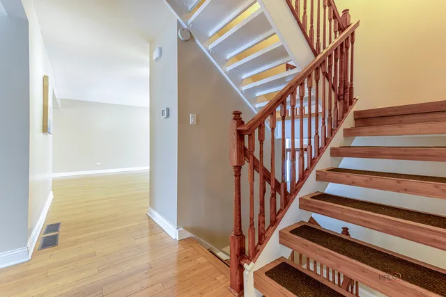 a view of entryway with wooden floor