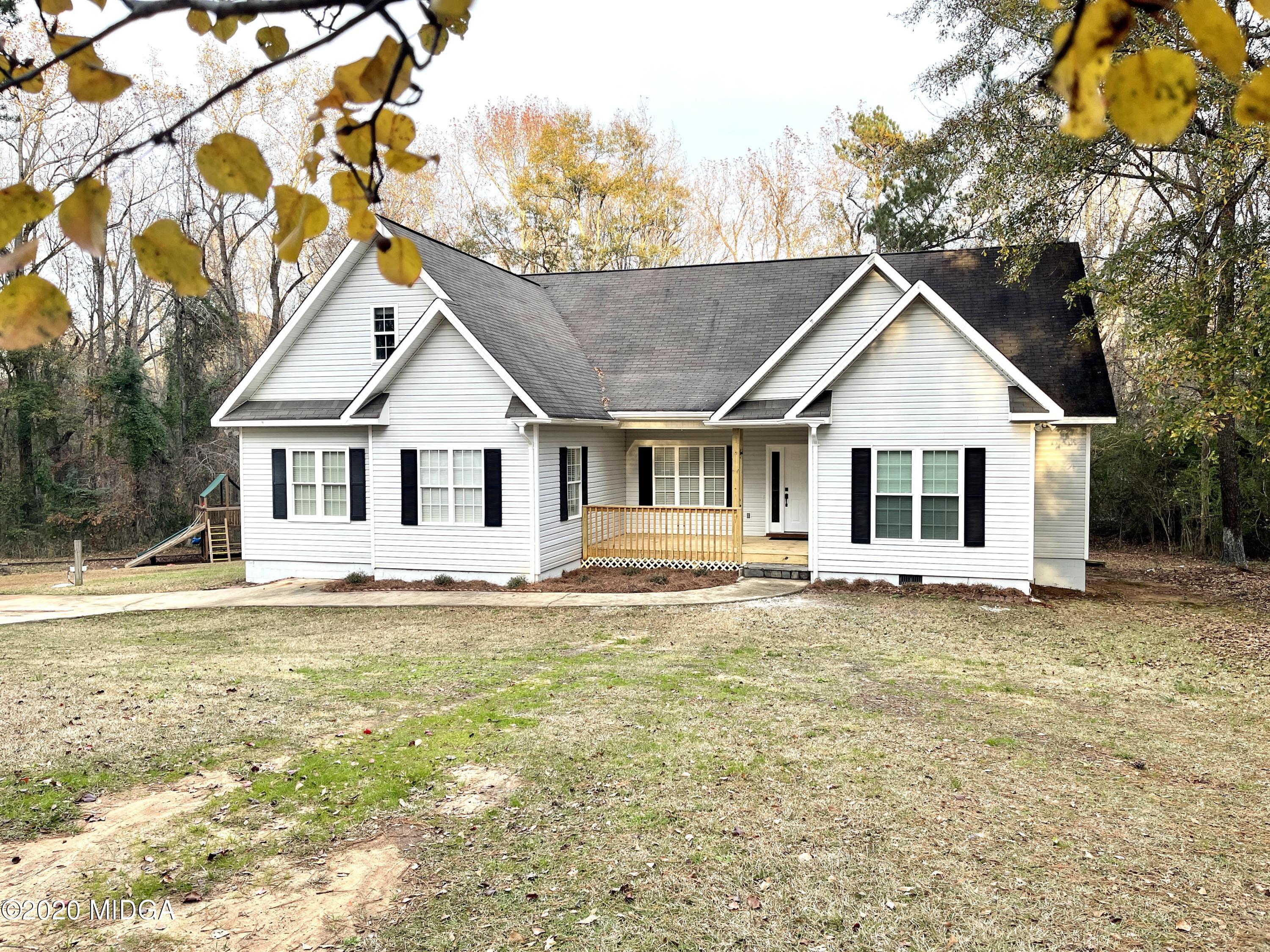 284 Klopfer Road Juliette, GA 31046 - Photo 1 of 15 a view of a house with a yard and large tree