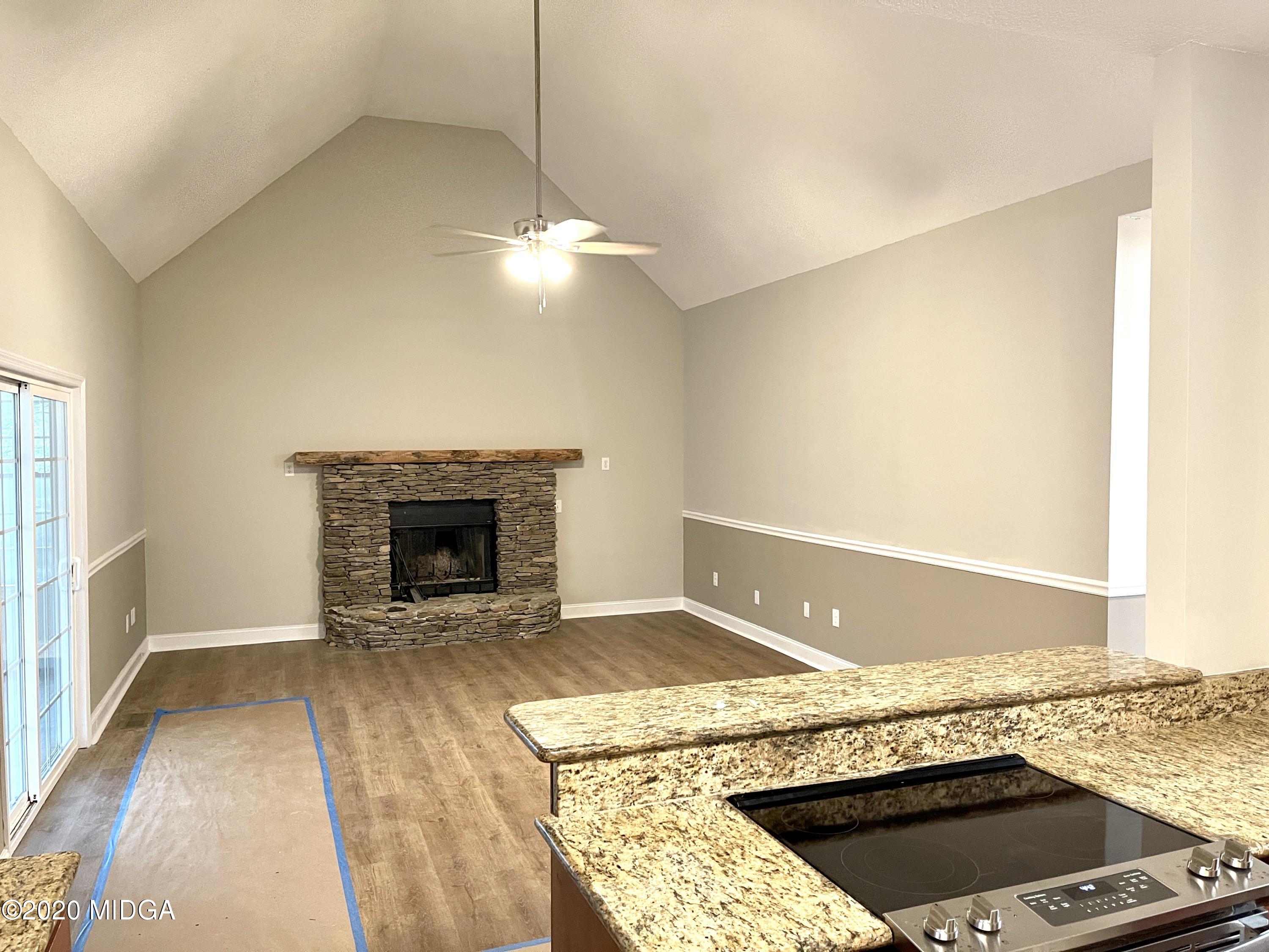 284 Klopfer Road Juliette, GA 31046 - Photo 3 of 15 a living room with a fireplace and a rug